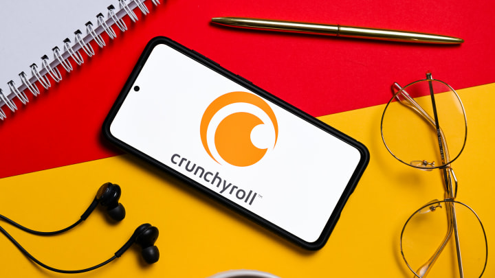 In this photo illustration a Crunchyroll logo seen displayed...