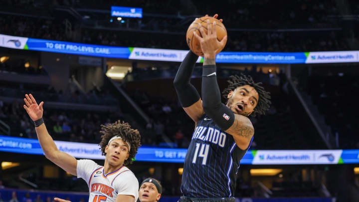 Feb 7, 2023; Orlando, Florida, USA; Orlando Magic guard Gary Harris (14) grabs a rebound against the New York Knicks during the first quarter at Amway Center. Mandatory Credit: Mike Watters-USA TODAY Sports