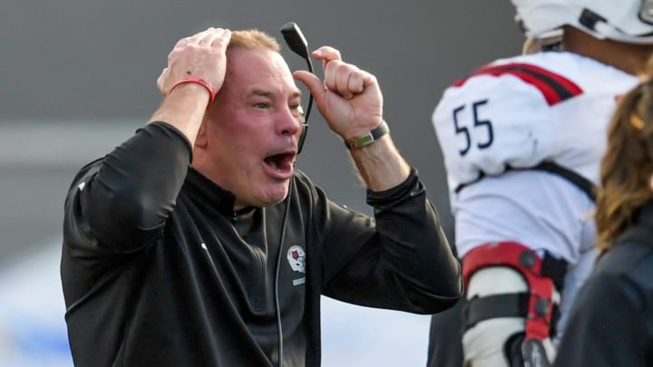 Arkansas State Red Wolves head coach Butch Jones coaches against the Northern Illinois Huskies in the Camellia Bowl at Cramton Bowl in Montgomery, Ala., on Saturday December 23, 2023.