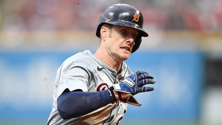 Jul 22, 2024; Cleveland, Ohio, USA; Detroit Tigers left fielder Mark Canha (21) rounds third base en route to scoring during the sixth inning against the Cleveland Guardians at Progressive Field. Mandatory Credit: Ken Blaze-USA TODAY Sports