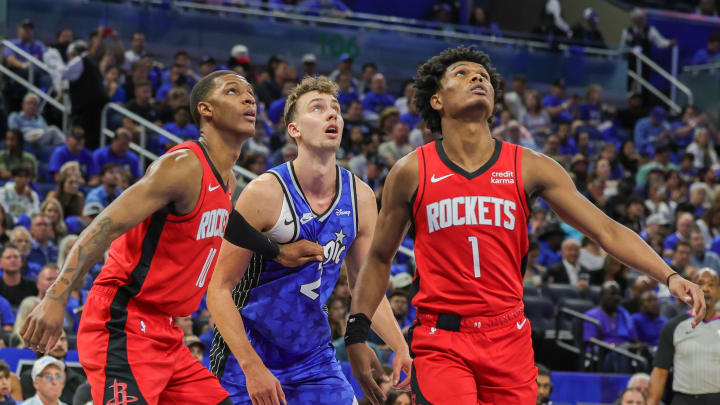 Oct 25, 2023; Orlando, Florida, USA; Orlando Magic forward Franz Wagner (22) Houston Rockets forward Amen Thompson (1) and forward Jabari Smith Jr. (10) looks for the rebound during the first quarter at Amway Center. Mandatory Credit: Mike Watters-USA TODAY Sports