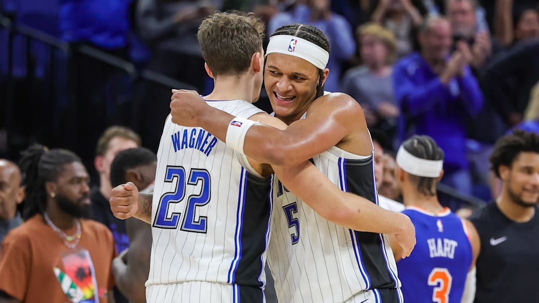Dec 29, 2023; Orlando, Florida, USA; Orlando Magic forward Franz Wagner (22) and forward Paolo Banchero (5) celebrate their 117-108 win against the New York Knicks at KIA Center. Mandatory Credit: Mike Watters-Imagn Images
