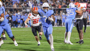 Nov 11, 2023; Orlando, Florida, USA; UCF Knights running back RJ Harvey (7) carries the ball for a touchdown during the second half against the Oklahoma State Cowboys at FBC Mortgage Stadium. Mandatory Credit: Mike Watters-USA TODAY Sports