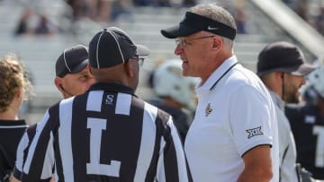 Oct 28, 2023; Orlando, Florida, USA; UCF Knights head coach Gus Malzahn talks with officials before the game against the West Virginia Mountaineers at FBC Mortgage Stadium. Mandatory Credit: Mike Watters-USA TODAY Sports