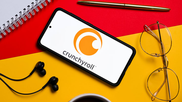 In this photo illustration a Crunchyroll logo seen displayed...