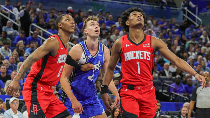 Oct 25, 2023; Orlando, Florida, USA; Orlando Magic forward Franz Wagner (22) Houston Rockets forward Amen Thompson (1) and forward Jabari Smith Jr. (10) looks for the rebound during the first quarter at Amway Center. Mandatory Credit: Mike Watters-USA TODAY Sports