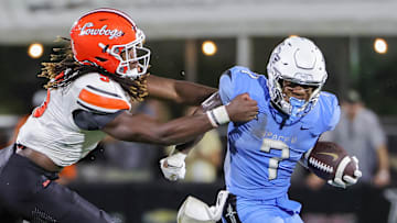 Nov 11, 2023; Orlando, Florida, USA; UCF Knights running back RJ Harvey (7) runs the ball against Oklahoma State Cowboys safety Trey Rucker (9) during the second half at FBC Mortgage Stadium. Mandatory Credit: Mike Watters-Imagn Images
