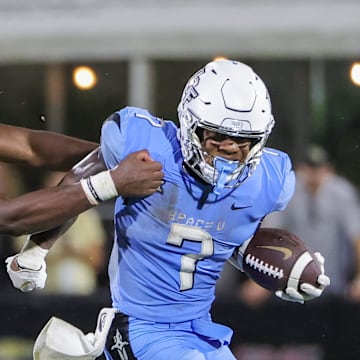 Nov 11, 2023; Orlando, Florida, USA; UCF Knights running back RJ Harvey (7) runs the ball against Oklahoma State Cowboys safety Trey Rucker (9) during the second half at FBC Mortgage Stadium. Mandatory Credit: Mike Watters-Imagn Images