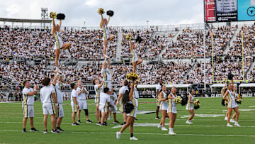 Sep 30, 2023; Orlando, Florida, USA; UCF Knights cheer team preforms during a time out against the Baylor Bears at FBC Mortgage Stadium. Mandatory Credit: Mike Watters-USA TODAY Sports