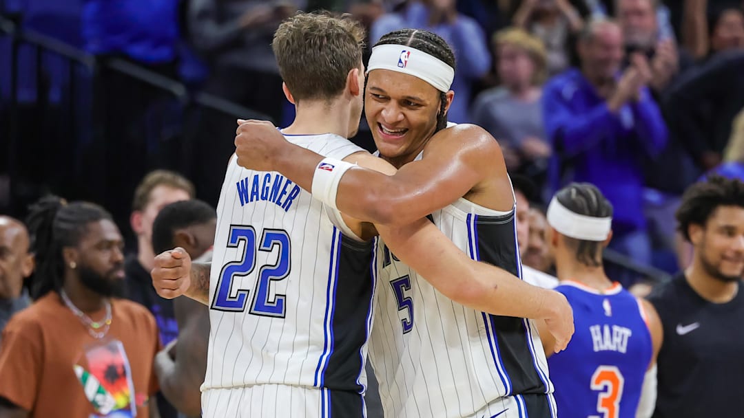 Dec 29, 2023; Orlando, Florida, USA; Orlando Magic forward Franz Wagner (22) and forward Paolo Banchero (5) celebrate their 117-108 win against the New York Knicks at KIA Center. Mandatory Credit: Mike Watters-Imagn Images