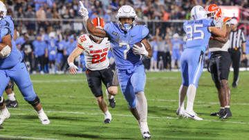 Nov 11, 2023; Orlando, Florida, USA; UCF Knights running back RJ Harvey (7) carries the ball for a touchdown during the second half against the Oklahoma State Cowboys at FBC Mortgage Stadium. Mandatory Credit: Mike Watters-USA TODAY Sports