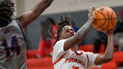 Percy Julian's Terrell Todd (5) is defended by Park Crossing's Jadarien McGhee (14) during their game at the Percy Julian campus in Montgomery, Ala., on Saturday January 4, 2025.
