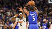 Orlando Magic forward Paolo Banchero (5) shoots the ball against Denver Nuggets guard Kentavious Caldwell-Pope (5) during the first quarter at Amway Center.