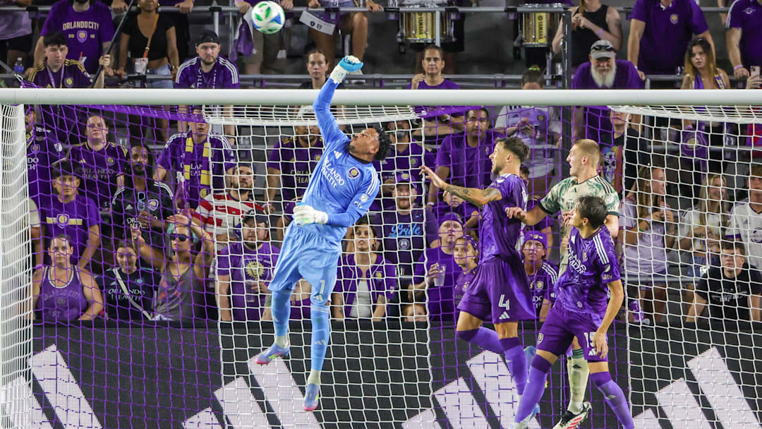 May 24, 2025; Orlando, Florida, USA; Orlando City goalkeeper Pedro Gallese (1) blocks a shot during the second half against the Portland Timbers at Inter&Co Stadium. Mandatory Credit: Mike Watters-Imagn Images