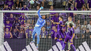 May 24, 2025; Orlando, Florida, USA; Orlando City goalkeeper Pedro Gallese (1) blocks a shot during the second half against the Portland Timbers at Inter&Co Stadium. Mandatory Credit: Mike Watters-Imagn Images