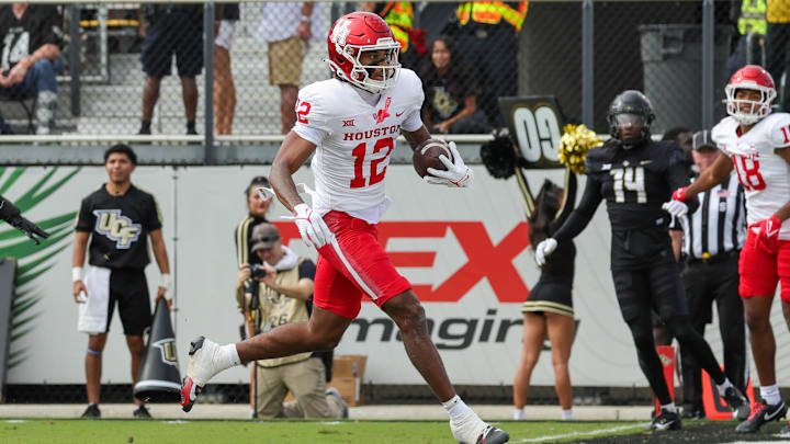 Nov 25, 2023; Orlando, Florida, USA; Houston Cougars wide receiver Stephon Johnson (12) scores a touchdown against the UCF Knights.