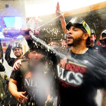 Oct 11, 2023; Phoenix, AZ, USA; Arizona Diamondbacks Tommy Pham sprays champagne during clubhouse celebrations after sweeping the Los Angeles Dodgers 3-0 to win the NLDS at Chase Field. Mandatory Credit: Rob Schumacher-Arizona Republic