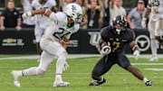 Sep 30, 2023; Orlando, Florida, USA; UCF Knights running back RJ Harvey (7) runs the ball against Baylor Bears safety Corey Gordon Jr. (24) during the second half at FBC Mortgage Stadium. Mandatory Credit: Mike Watters-Imagn Images