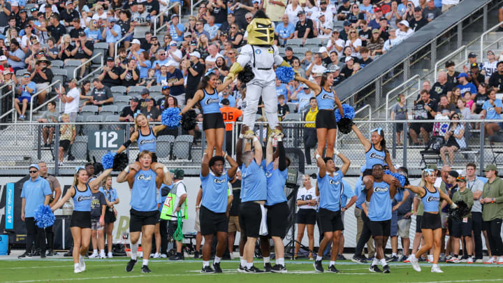 Nov 11, 2023; Orlando, Florida, USA; UCF Knights cheer team perform during the first quarter against the Oklahoma State Cowboys at FBC Mortgage Stadium. Mandatory Credit: Mike Watters-USA TODAY Sports