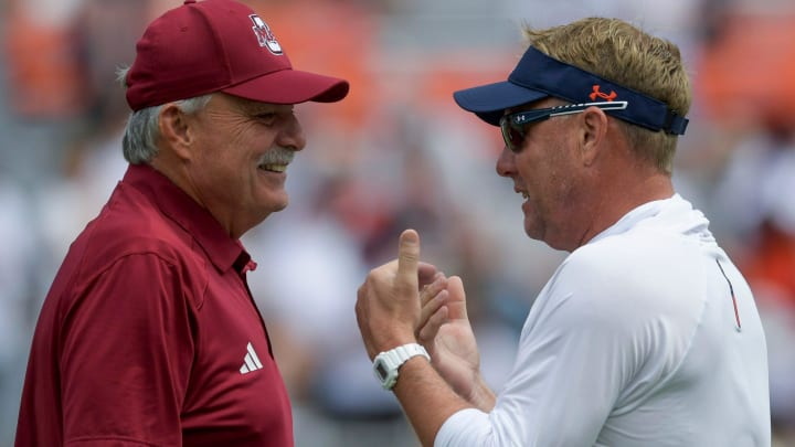 UMass Minuteman head coach Don Brown and Auburn Tigers head coach Hugh Freeze chat during warmups before their game at Jordan-Hare Stadium on the Auburn University campus in Auburn, Ala., on Saturday September 2, 2023.