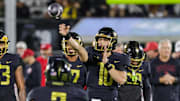 Nov 29, 2024; Orlando, Florida, USA; UCF Knights quarterback Dylan Rizk (10) warms up before the game against the Utah Utes at FBC Mortgage Stadium. Mandatory Credit: Mike Watters-Imagn Images