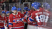 Apr 8, 2025; Montreal, Quebec, CAN; Montreal Canadiens forward Nick Suzuki (14) celebrates with teammates after scoring a goal against the Detroit Red Wings during the third period at the Bell Centre. Mandatory Credit: Eric Bolte-Imagn Images