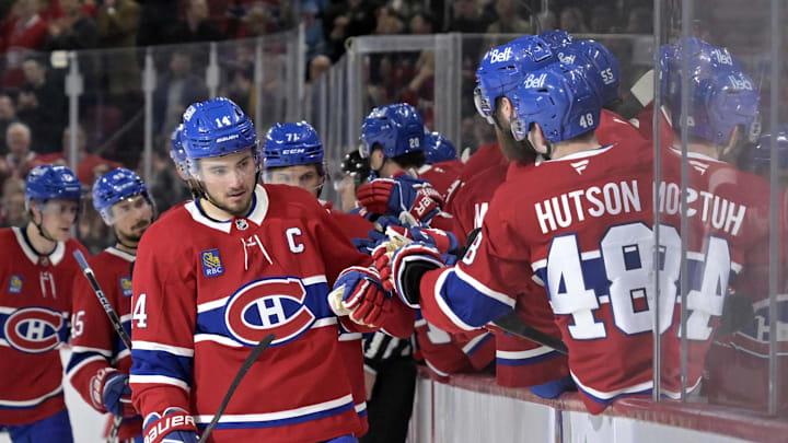 Apr 8, 2025; Montreal, Quebec, CAN; Montreal Canadiens forward Nick Suzuki (14) celebrates with teammates after scoring a goal against the Detroit Red Wings during the third period at the Bell Centre. Mandatory Credit: Eric Bolte-Imagn Images