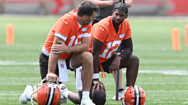 Jun 10, 2025; Berea, OH, USA; Cleveland Browns quarterback Joe Flacco (15) talks to quarterback Shedeur Sanders (12) during m