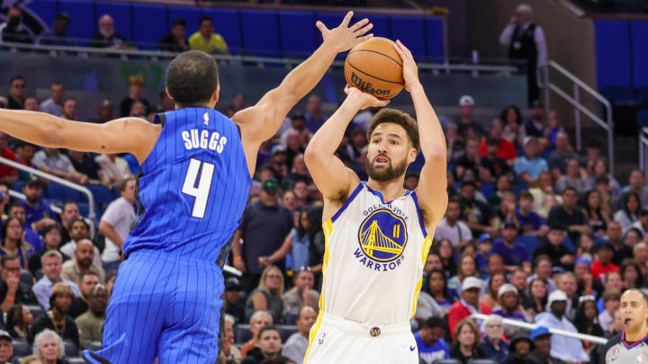 Nov 3, 2022; Orlando, Florida, USA; Golden State Warriors guard Klay Thompson (11) shoots the ball against Orlando Magic guard Jalen Suggs (4) during the first quarter at Amway Center. 