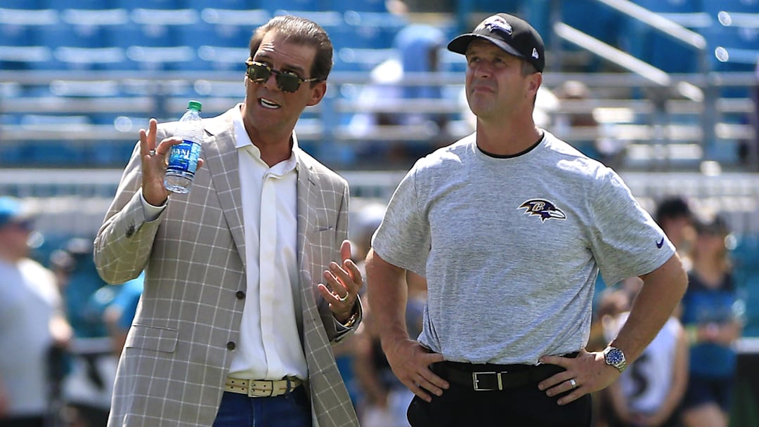 Sep 25, 2016; Jacksonville, FL, USA; Baltimore Ravens head coach John Harbaugh (R) talks to team owner Steve Bisciotti (L) prior to their game against the Jacksonville Jaguars at EverBank Field. Mandatory Credit: Reinhold Matay-Imagn Images