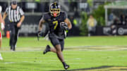 UCF Knights running back RJ Harvey (7) runs the ball during the second quarter against the Utah Utes at FBC Mortgage Stadium. 