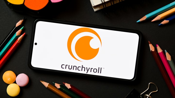 In this photo illustration a Crunchyroll logo seen displayed...