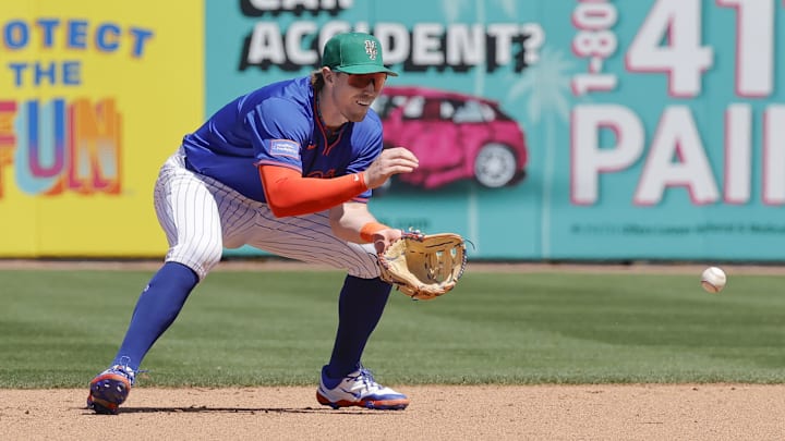 Mar 17, 2025; Port St. Lucie, Florida, USA; New York Mets third base Brett Baty (7) fields a ground ball during the fifth inning against the Tampa Bay Rays at Clover Park. Mandatory Credit: Reinhold Matay-Imagn Images Mar 17, 2025; Port St. Lucie, Florida, USA; New York Mets third base Brett Baty (7) fields a ground ball during the fifth inning against the Tampa Bay Rays at Clover Park. Mandatory Credit: Reinhold Matay-Imagn Images
