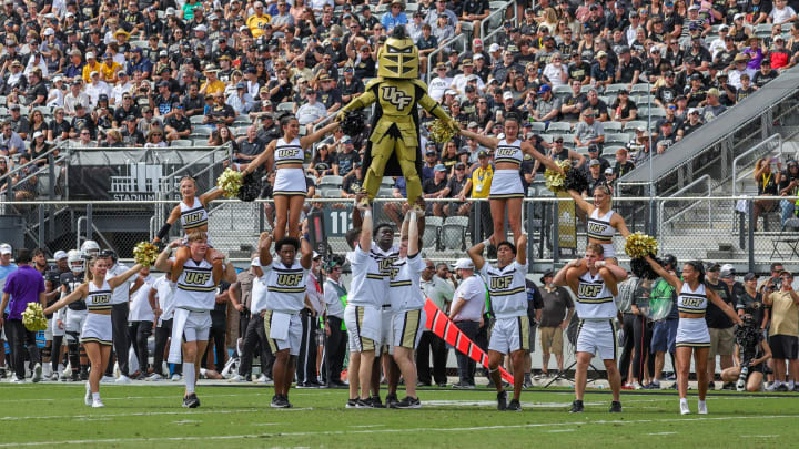Oct 28, 2023; Orlando, Florida, USA; UCF Knights cheer team perform before the game against the West Virginia Mountaineers at FBC Mortgage Stadium. Mandatory Credit: Mike Watters-USA TODAY Sports