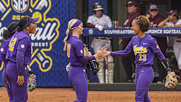 May 7, 2025; Athens, GA, USA; LSU starting pitcher/relief pitcher Jayden Heavener (00) reacts with infielder Danieca Coffey (13) after LSU defeated Mississippi St. at Jack Turner Stadium. Mandatory Credit: Dale Zanine-Imagn Images