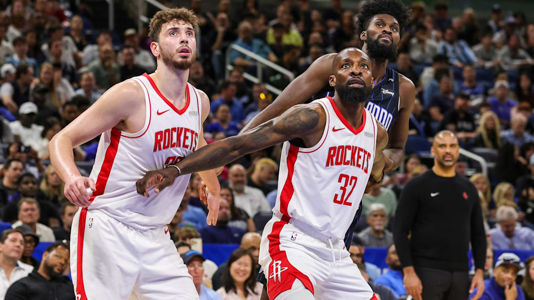 Houston Rockets center Alperen Sengun (28), forward Jeff Green (32) and Orlando Magic forward Jonathan Isaac (1) look for the rebound during the second quarter at Kia Center.