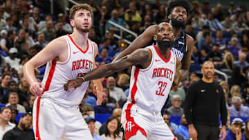 Houston Rockets center Alperen Sengun (28), forward Jeff Green (32) and Orlando Magic forward Jonathan Isaac (1) look for the rebound during the second quarter at Kia Center.