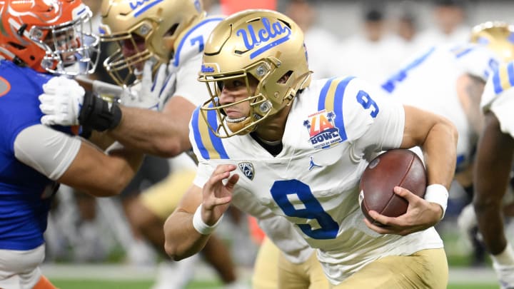 Dec 16, 2023; Inglewood, CA, USA; UCLA Bruins quarterback Collin Schlee (9) carries the ball against the Boise State Broncos during the first quarter of the Starco Brands LA Bowl at SoFi Stadium. Mandatory Credit: Robert Hanashiro-USA TODAY Sports