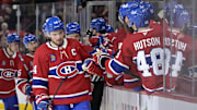 Apr 8, 2025; Montreal, Quebec, CAN; Montreal Canadiens forward Nick Suzuki (14) celebrates with teammates after scoring a goal against the Detroit Red Wings during the third period at the Bell Centre. Mandatory Credit: Eric Bolte-Imagn Images