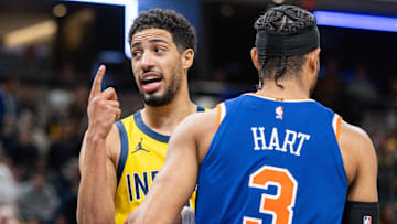 Nov 10, 2024; Indianapolis, Indiana, USA;  Indiana Pacers guard Tyrese Haliburton (0) celebrates a call in the while talking to New York Knicks guard Josh Hart (3) during the second half  at Gainbridge Fieldhouse. Mandatory Credit: Trevor Ruszkowski-Imagn Images