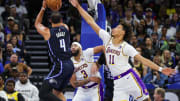 Nov 4, 2023; Orlando, Florida, USA; Orlando Magic guard Jalen Suggs (4) shoots the ball against Los Angeles Lakers forward Anthony Davis (3) and center Jaxson Hayes (11) during the first quarter at Amway Center. Mandatory Credit: Mike Watters-USA TODAY Sports