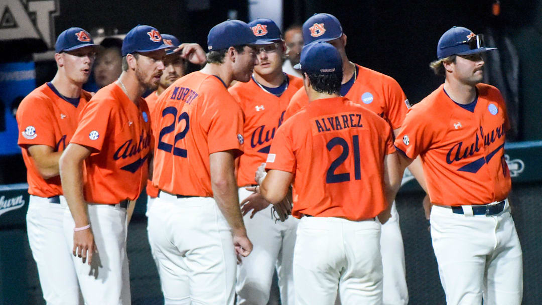 Auburn Tigers' Andreas Alvarez (21) is greeted at the dugout after closing out an inning against the NC State Wolfpack during the NCAA Regional Baseball Tournament at Plainsman Park in Auburn, Ala., on Sunday June 1, 2025.