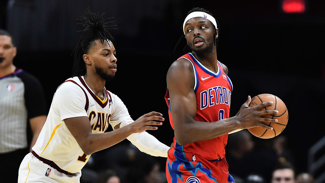 Mar 19, 2022; Cleveland, Ohio, USA; Cleveland Cavaliers guard Darius Garland (10) defends Detroit Pistons forward Jerami Grant (9) during the second half at Rocket Mortgage FieldHouse. Mandatory Credit: Ken Blaze-Imagn Images