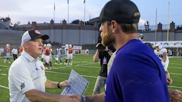 Mercer head coach Drew Cronic, left, greets North Alabama head coach Brent Dearmon after the FCS Kickoff held at Cramton Bowl in Montgomery, Ala., on Saturday August 26, 2023.