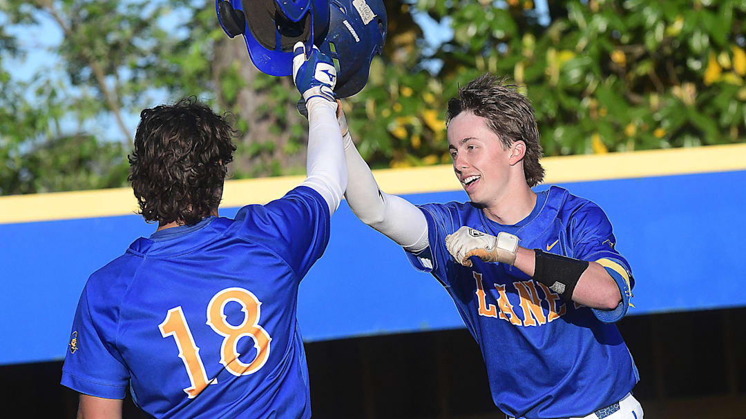Laney’s #8 Owen Gore celebrates with his team after hitting a homerun as Laney played New Hanover in baseball April 28, 2026.