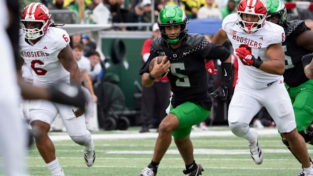 oregon ducks dante moore dan lanning heisman trophy quarterback indiana hoosiers fernando mendoza carson beck john mateer