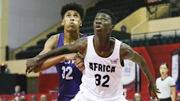Aug 11, 2019; Orlando, FL, USA; West guard Quinton Webb (left) and Africa guard Badara Aliou Diakite battle for a rebound during the first half of the boys Jr. NBA Global Championship Game at ESPN Wide World of Sports Complex. Mandatory Credit: Reinhold Matay-Imagn Images