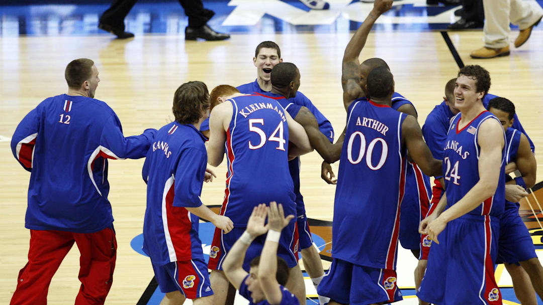 Apr 7, 2008; San Antonio, TX, USA; Members of the Kansas Jayhawks celebrate after defeating the Memphis Tigers in the finals of the 2008 NCAA Mens Final Four Championship at the Alamodome.  Kansas defeated Memphis 75-68 in overtime to win the national championship. 