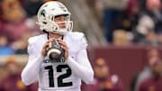Oct 28, 2023; Minneapolis, Minnesota, USA; Michigan State Spartans quarterback Katin Houser (12) looks to pass against the Minnesota Golden Gophers during the second quarter at Huntington Bank Stadium. Mandatory Credit: Nick Wosika-Imagn Images