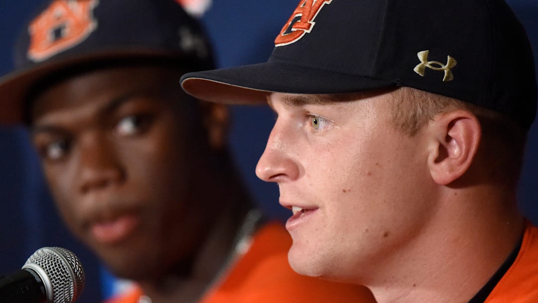 Auburn Tigers' Ike Irish (18) talks about the win over NC State as Bub Terrell (19) looks on during the NCAA Regional Baseball Tournament at Plainsman Park in Auburn, Ala., on Sunday June 1, 2025.